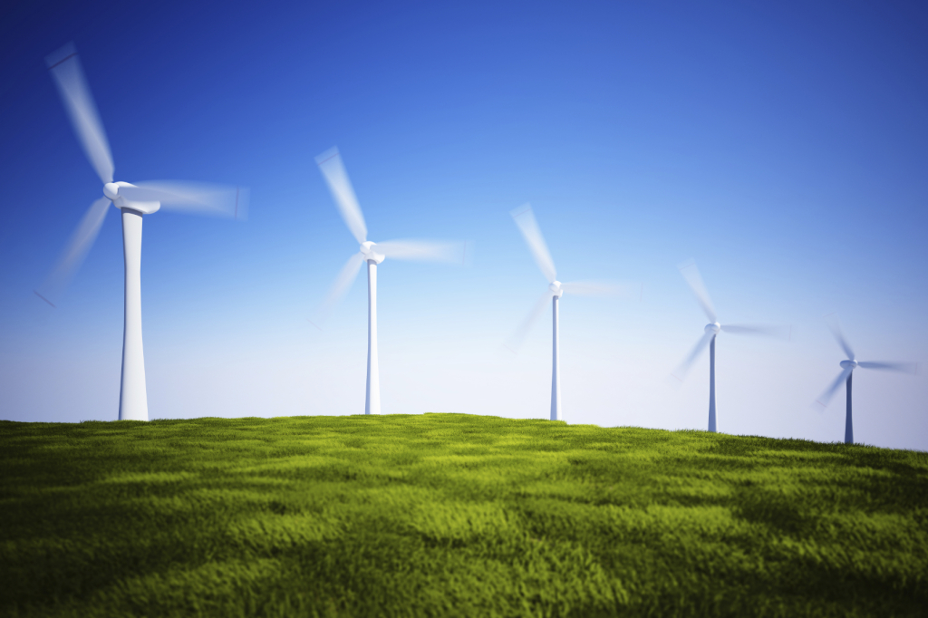 Wind turbines on green grass field